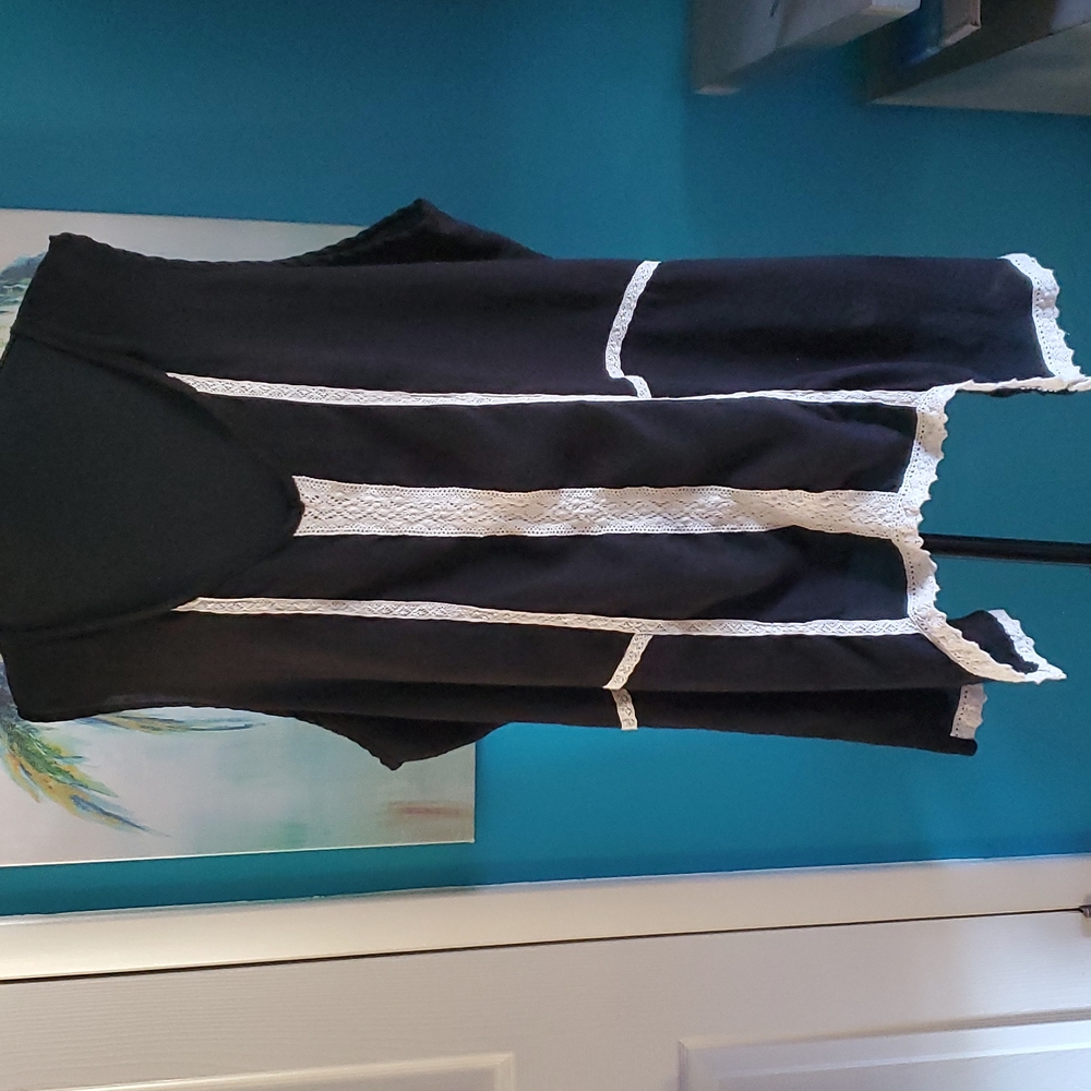 Sleeveless size 3x Cute black with cream crochet lines.